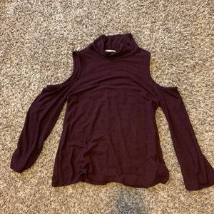 The outfit turtle neck with slit shoulders